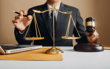 Business and lawyers discussing contract papers with brass scale on desk in office. Law, legal...