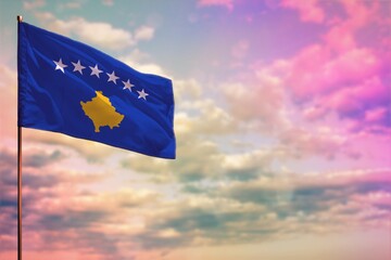 Fluttering Kosovo flag mockup with the space for your content on colorful cloudy sky background.