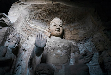 Seated statue of Amitabha Buddha in Cave 3 at Yungang Grottoes, Datong, Shanxi, China. Created from 5th century during Northern Wei period. UNESCO World Heritage Site.