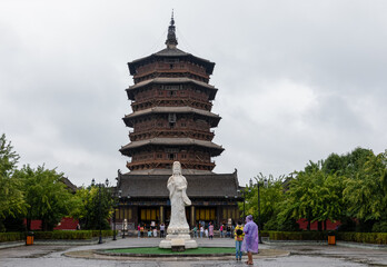 Wooden Pagoda or Sakyamuni Pagoda at Fogong ChinaTemple in Yingxian, Shuozhou, Shanxi, c. Built in 1056. World's tallest & oldest existing wooden tower. Guanying statue in front.
