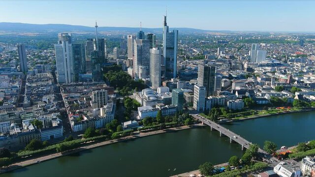 Aerial view of city skyline of Frankfurt am Main, cityscape with modern buildings (skyscrapers) with clear blue sky behind them - landscape panorama of Germany from above, Europe