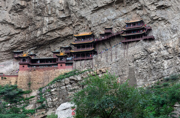 Xuankong or Hanging Temple on cliff at Mount Heng in Hunyuan, Datong, Shanxi, China. Over 1500 years old, mixing Buddhism, Taoism & Confucianism. Tourist attraction & heritage.