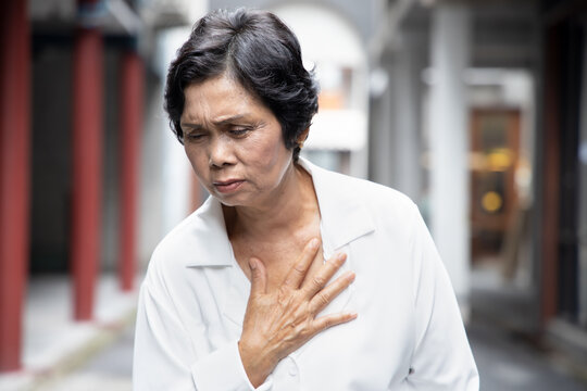 Sick Old Senior Woman Suffering From GERD Or Acid Reflux