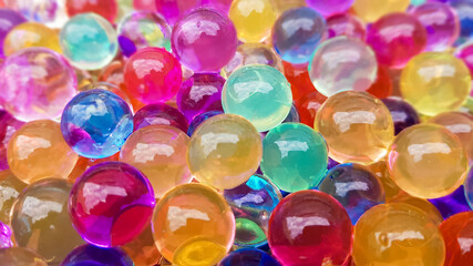Lots of different colored hydrogel balls. Set of multicolored orbis. Crystal water beads for games....
