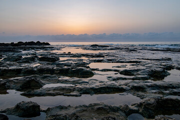 Obraz premium Beautiful view of beach or sea side with amazing waves. long exposure of sea and rocks