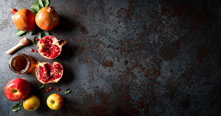 Rosh hashanah (Jewish New Year holiday), Concept of traditional or religion symbols on dark stone background.