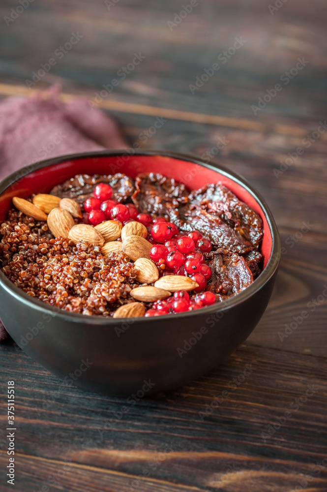 Sticker Bowl of red quinoa with nuts and sun-dried tomatoes