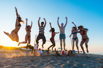 Group of friends partying at the beach