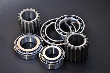 Car parts gears and bearings on on a black background