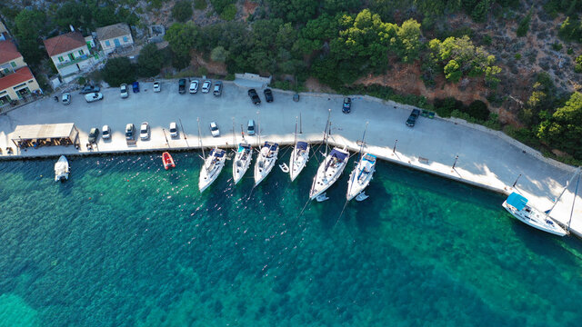 Aerial drone top down photo of sail boats anchored in small port of Frikes, Ithaki or Ithaca island, Ionian, Greece