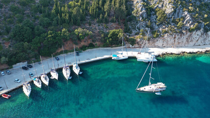 Aerial drone photo of picturesque small fishing village of Frikes a safe anchorage for sail boats and yachts in island of Ithaki or Ithaca, Ionian, Greece