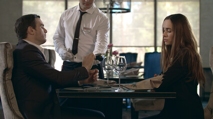 Business man paying restaurant bill by credit card. Businessman paying for bill