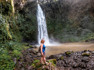 Girl enjoying waterfall 