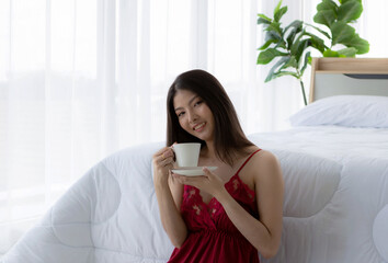 Business woman Asian girl Sitting in bedroom.