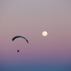 paragliding in the night with full moon, Brazil