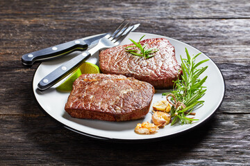fried rump beef steaks on a plate