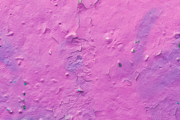 Cracked plaster, peeling pink paint on a concrete wall, scratched stucco texture, decorative design wallpaper, abstract background, natural pattern, grunge surface.