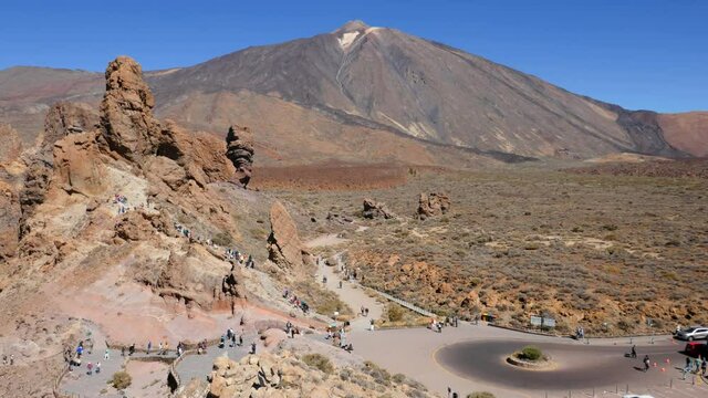 Hyper lapse people hiking on Los Roques de Garcia rocks near the Teide volcano, Teide National Park, Tenerife, Canary islands, Spain.