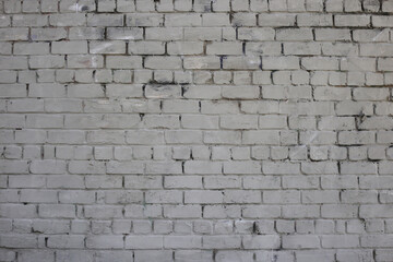 Grey brick wall. Weathered texture stained old paint grey brick wall. Colored brick wall background