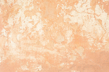 beige cracked plaster texture, with elements of rubbed white paint. Pastel tone textured street wall