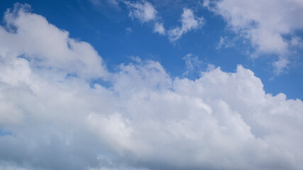 Naklejka na ściany i meble Blue sky with big white clouds. panorama