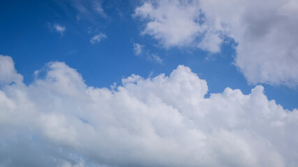 Naklejka na ściany i meble Blue sky with big white clouds. panorama