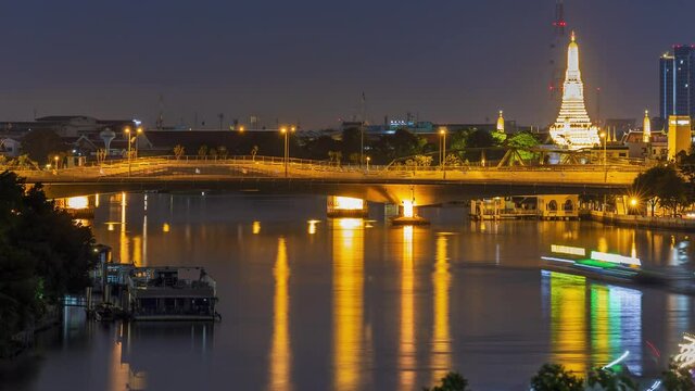 Footage 4k Timelapse long tail speed boat tour and boat traffic on the Chao Phraya River with a beautiful view of China Town and movement of boat traffic light colors in Bangkok, Thailand.