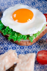 Egg with ham, vegetables and parmesan cheese