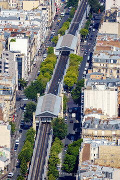 Paris, France - July 09 2020: High-angle shot of Paris aerial Metro line 6 with stations Cambronne and La Motte-Picquet Grenelle - Paris, France. Day shot from Tour Montparnasse observation desk.