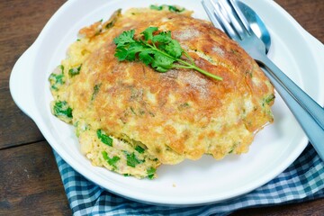 Thai food Omelet with minced pork, coriander, chopped green onion