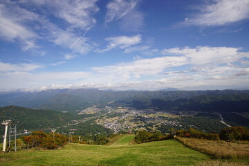 Fototapeta na wymiar Majestic mountains landscape under blue sky with clouds in Japan