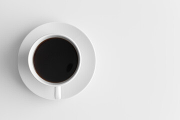 Top view of a cup of coffee on a white table with blank copy space.