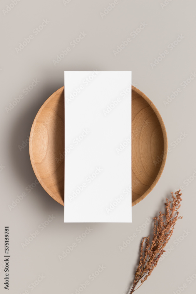 Sticker Menu card mockup on a wooden plate with a dry flower, 4x9 ratio.