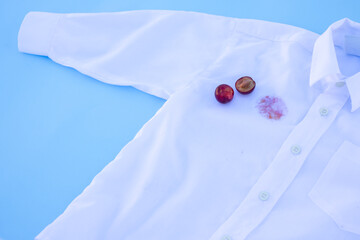 dirty stain on a white shirt.isolated on blue background