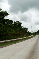 Fototapeta na wymiar Highway in Panama, modern concrete construction infrastructure in tropical rainy area.