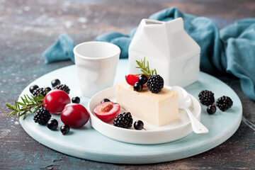 Cheesecake slice dessert, fresh berries and fruit, selective focus