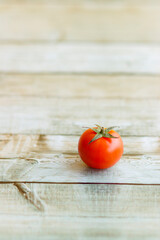 View of beautiful red cherry tomato on wooden background