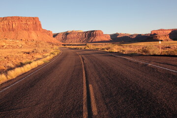 Scenic view of long road leading to Island in the Sky from The needles at sunset in Canyonlands National Park Utah, USA