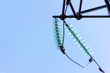 High voltage power lines against the background of a clear sky, high voltage power transmission...