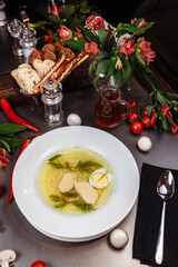 a white bowl filled with Delicious chicken noodle soup