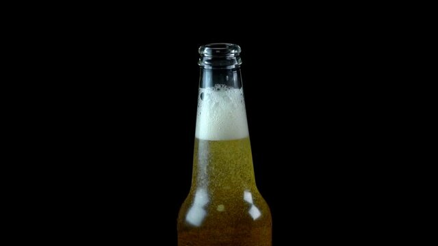 Freshly opened beer bottle. Place for your AD text.
