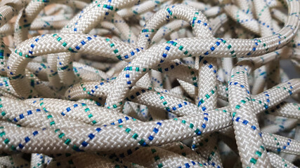 A background image of a tangled rope for rock climbing and mountaineering.