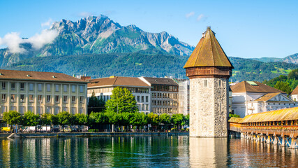 Scenic view of Pilatus mountain summit with the Chapel bridge and clear blue sky Lucerne Switzerland