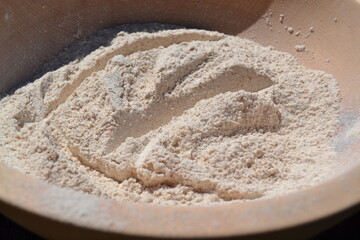 flour in a wooden bowl