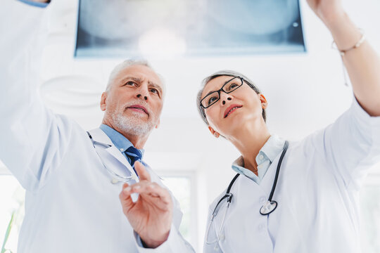 Low angle view medics with x-ray scan at hospital