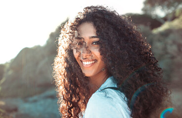 Beautiful smiley woman walking in the nature - 375157118