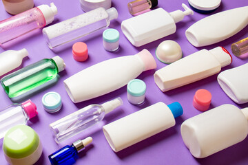 Group of plastic bodycare bottle Flat lay composition with cosmetic products on colored background empty space for you design. Set of White Cosmetic containers, top view with copy space