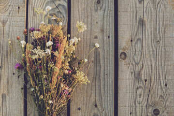 Beautiful bouquet of flowers on wooden table.