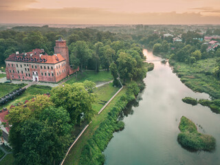 Uniejow Castle at evening - obrazy, fototapety, plakaty