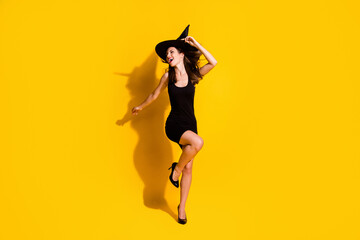 Fototapeta na wymiar Full length body size view of her she nice attractive pretty skinny chic ecstatic overjoyed cheerful cheery lady dancing having fun chill isolated bright vivid shine vibrant yellow color background
